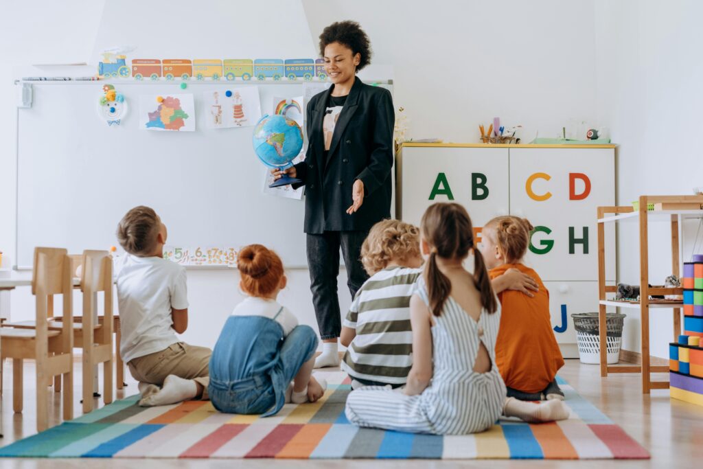 Photo by Mikhail Nilov: https://www.pexels.com/photo/children-sitting-on-colorful-rug-8923258/