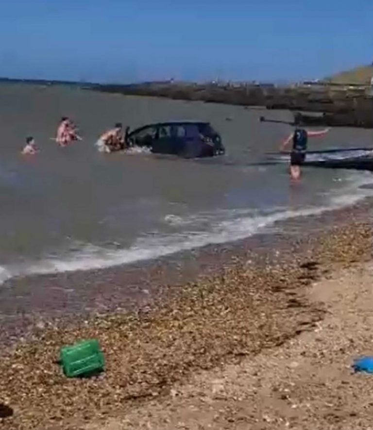 Dramatic video shows motorist trying to rescue car swept out to sea ...