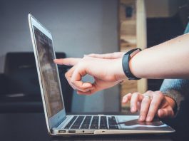 People pointing at a computer screen - business news Scotland