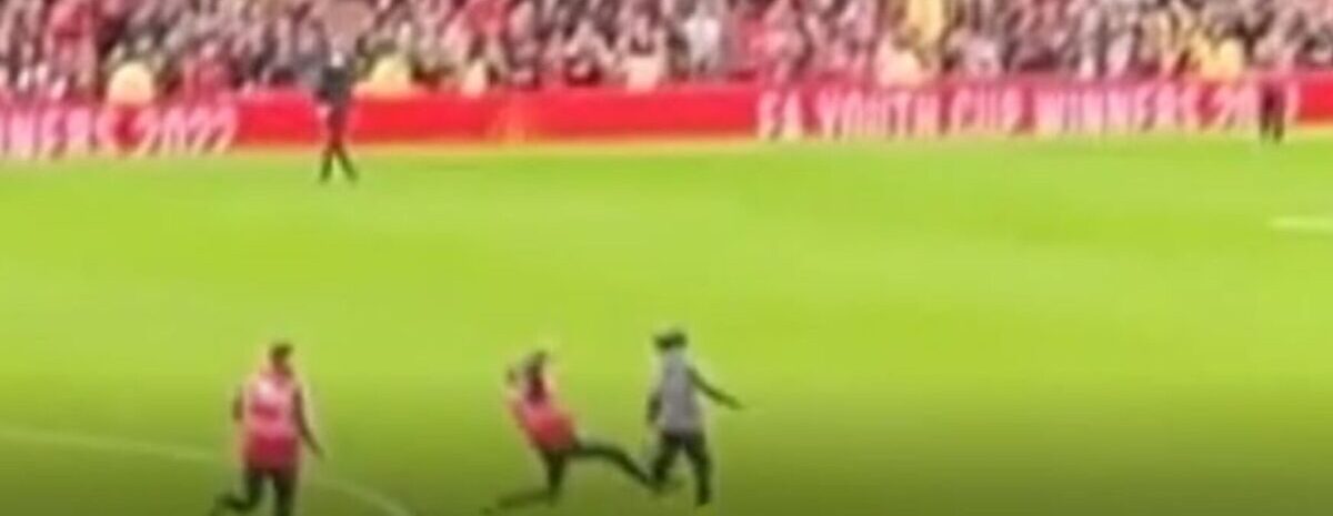 Video shows moment pitch invader gets slide tackled by security guard