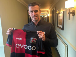 Gareth Bale holding a Sheffield FC shirt