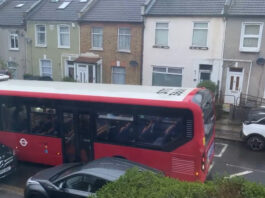 A bus was forced to reverse along the narrow road.