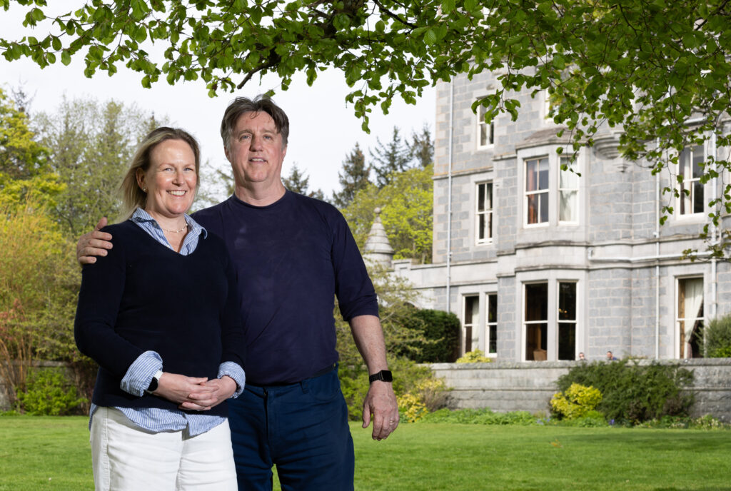 Campbell and Luci Carey outside the Ardoe Hotel, one of their first corporate clients. Image supplied with release by Frames.