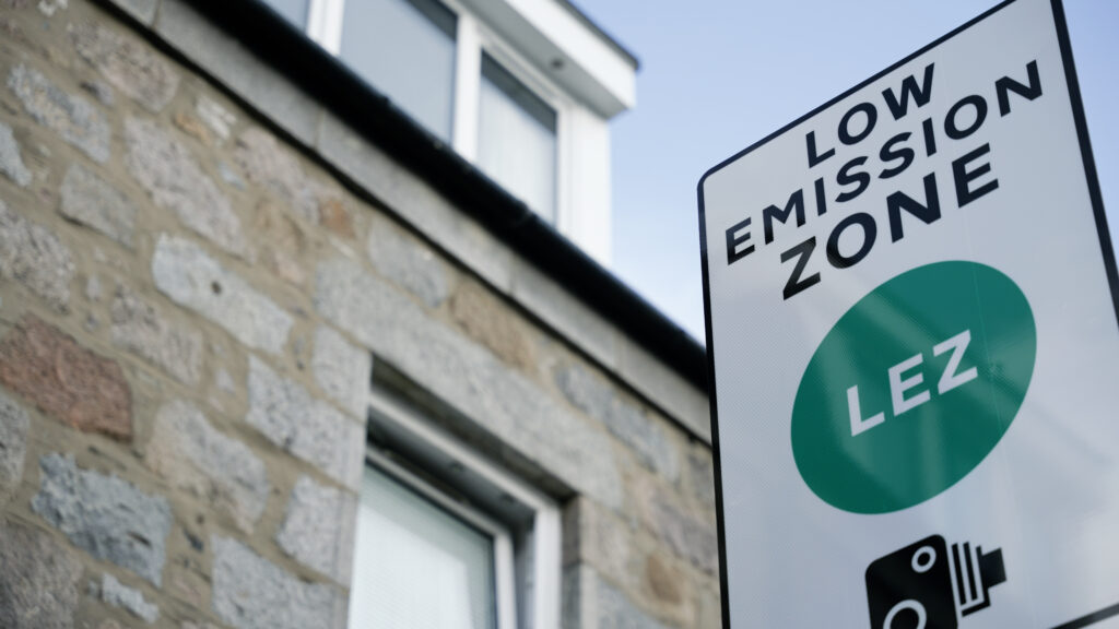 Low Emission Zone (LEZ) sign in front of building.