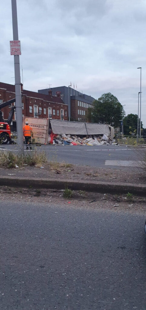 The lorry spilled its contents across the road.