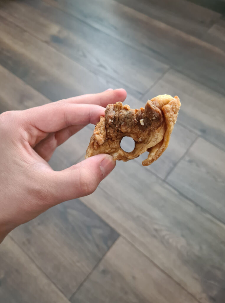 The customer was chuffed with his giant pork scratching.