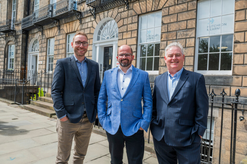 Adam Maitland, Craig-Hutcheon and Dougal-Bennet smile outside their office. Image supplied with release by Key Communications