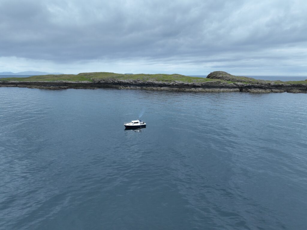 Boat in the waters of Fladda-chùain