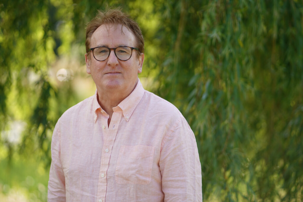 GBL CEO Dr. David McElroy standing in front of a tree.