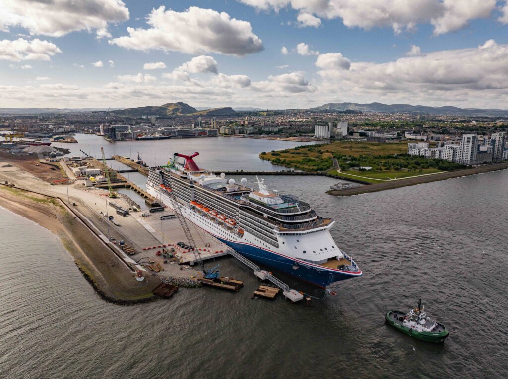 A large cruise vessel docked in a deep water berth