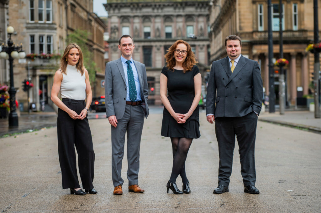 Gillian Green, Michael Collins, Mary Frances O'Neill and Liam McKay standing outside.