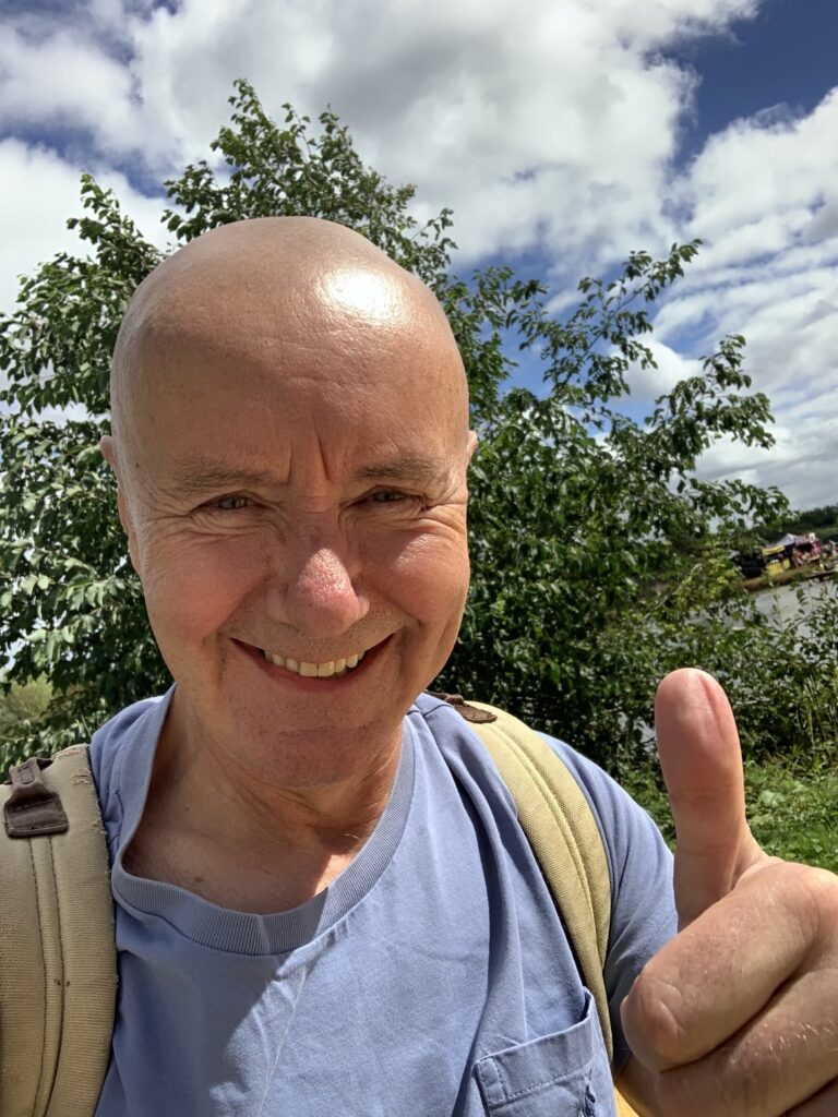 Scottish author Irvine Welsh giving a thumbs up