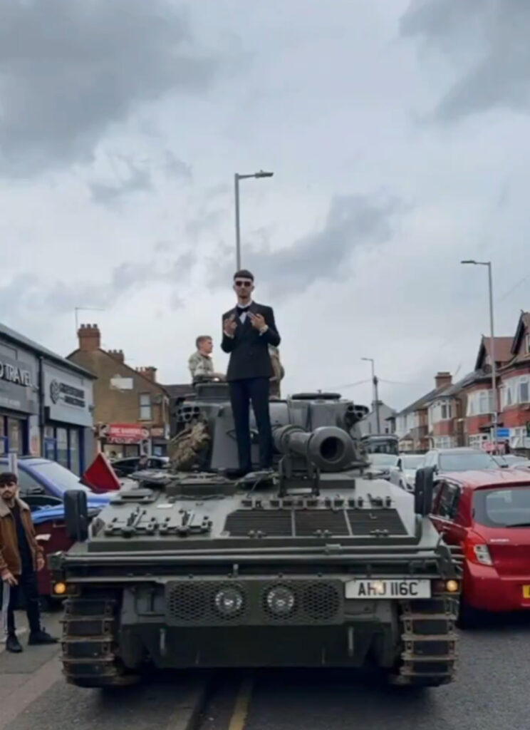 The teens were seen posing for pictures with their rented tank.