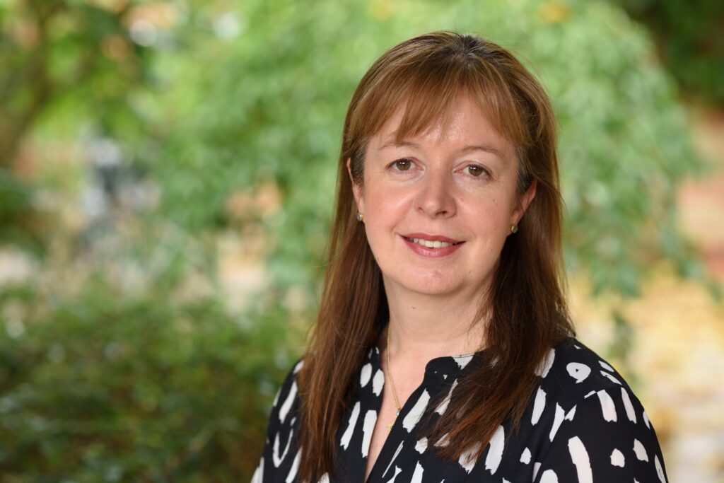 Sarah Murray smiling in her headshot. Image supplied with release by Spreng Thomson 