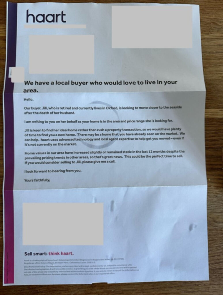 An image of a letter with black text on a white background, and a purple border on the left, titled: "We have a local buyer who would love to live in your area." There are a few stains on the paper, and any personal information has been digitally blanked out.