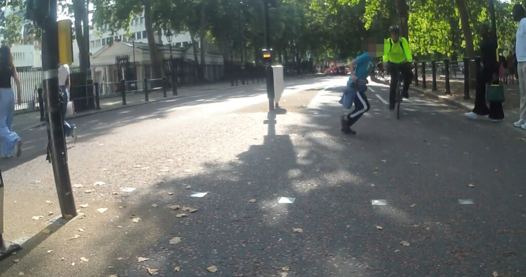 The youth was wiped out by the cyclist.