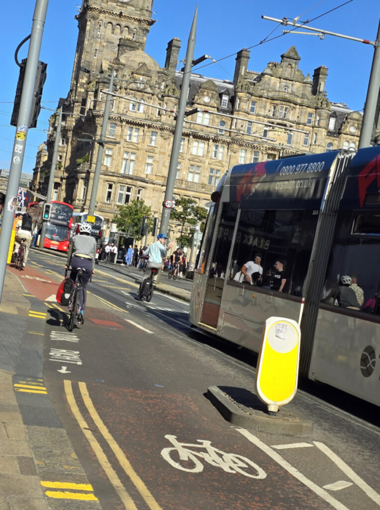 Entitled Edinburgh cyclist slammed after swerving in front of tram and sticking two fingers up at driver