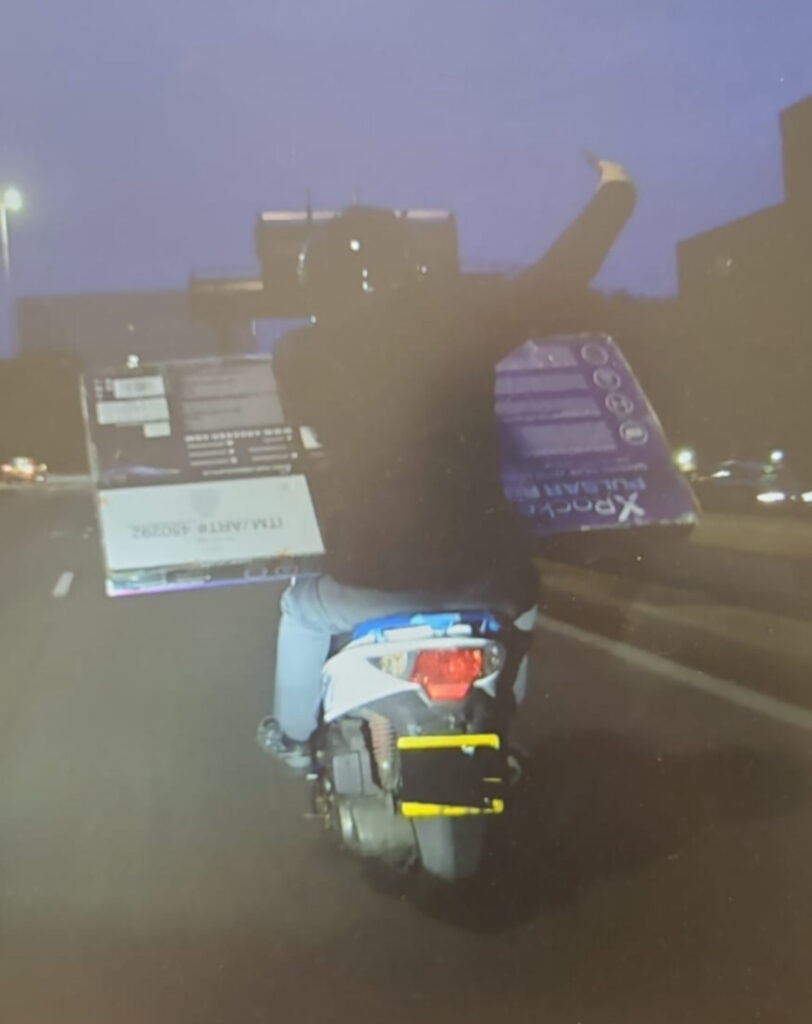 Pair of thieves making getaway on moped narrowly evade police by CHUCKING the TV they nicked at the pursuing officer