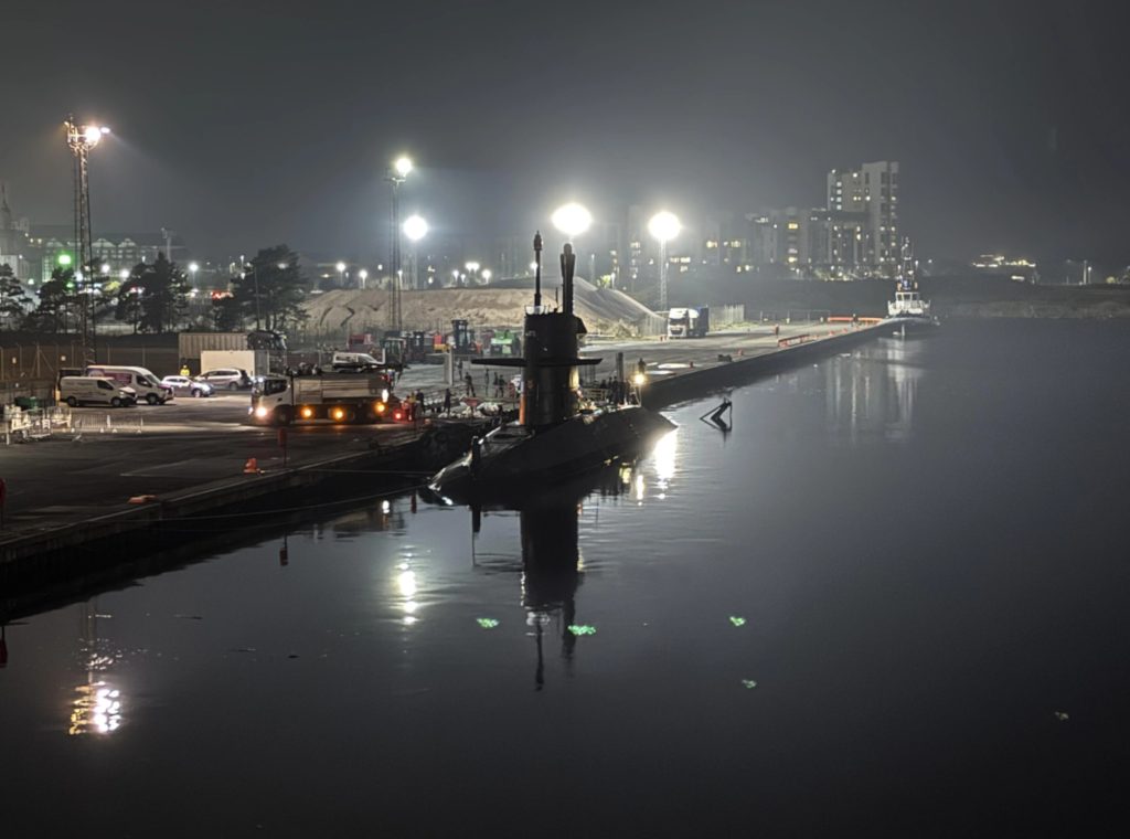 A NATO submarine was spotted surfacing from the depths of a busy Edinburgh port leaving local onlookers in awe.