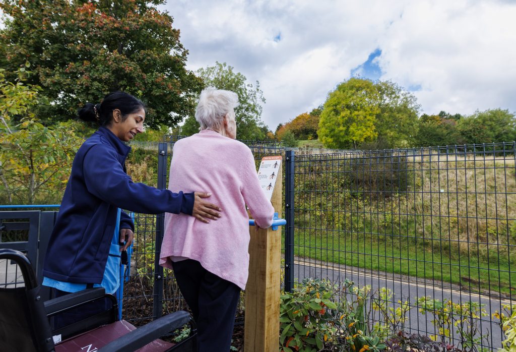 Staff and patient using new sensory garden supported by Paths for All | PR