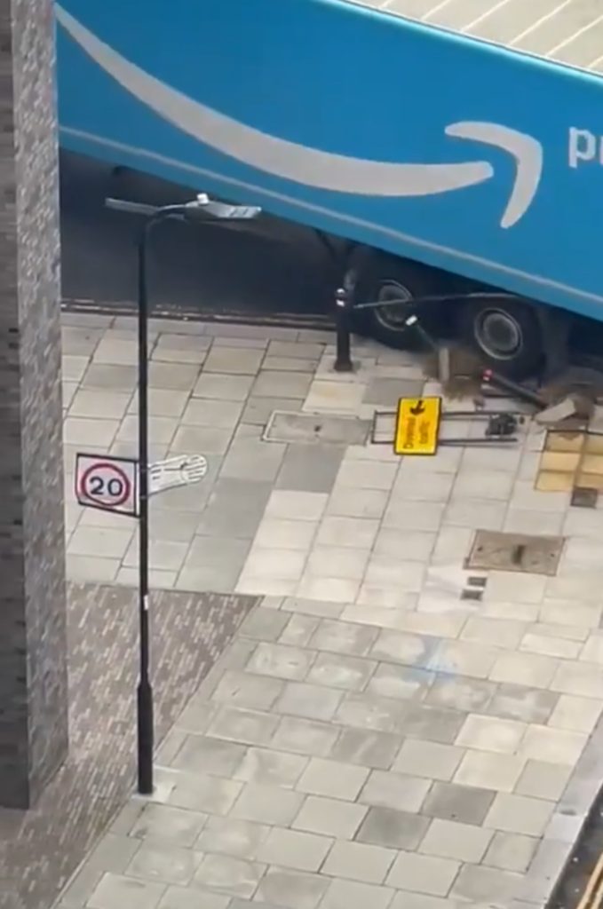 AN AMAZON delivery lorry has left a trail of destruction on residential streets after mounting pavements, cracking flagstones and destroying several bollards.