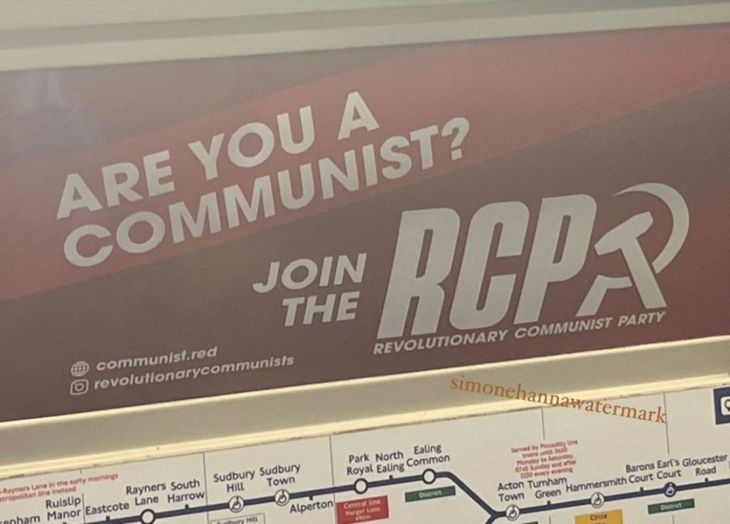 An image of a red poster with white text reading: "Are you a communist? Join the RCP- Revolutionary Communist Party."