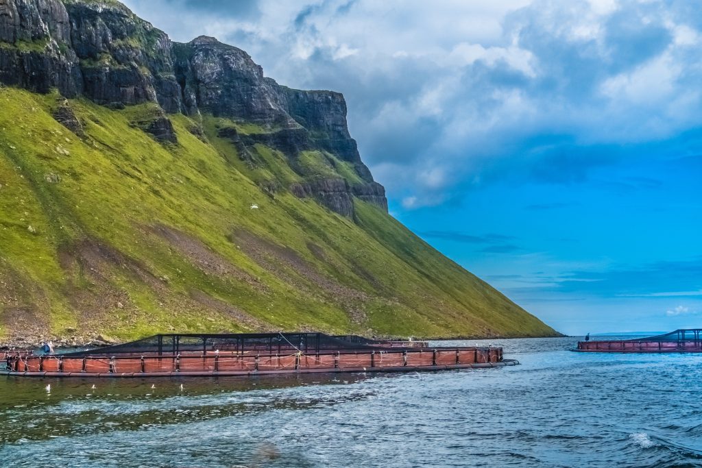 Salmon fish farm pools in the see lochs near Portree, Sound of Raasay, Isle of Skyue, Highlands of Scotland.