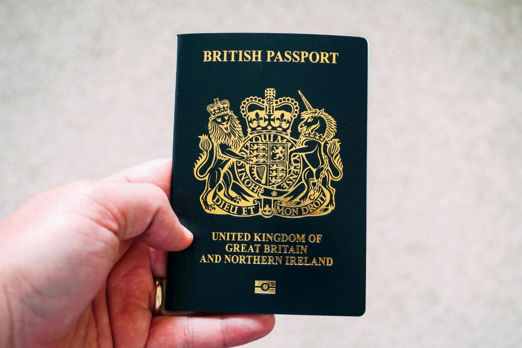 Photo by Ethan Wilkinson: https://www.pexels.com/photo/crop-unrecognizable-person-demonstrating-british-passport-5428705/