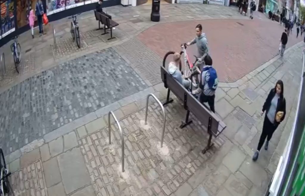 WATCH the horrifying moment a thug steals a bike from a child in broad daylight in the middle of a busy high street.