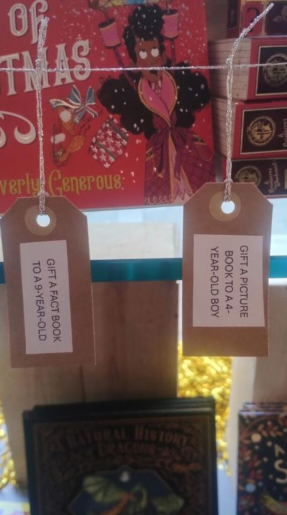 An image of gift tags printed with genres of books.