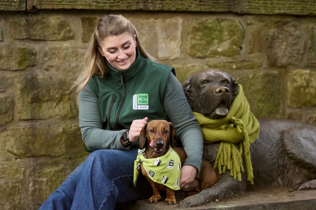 An image of an Edinburgh Dog and Cat Home member with her pet.