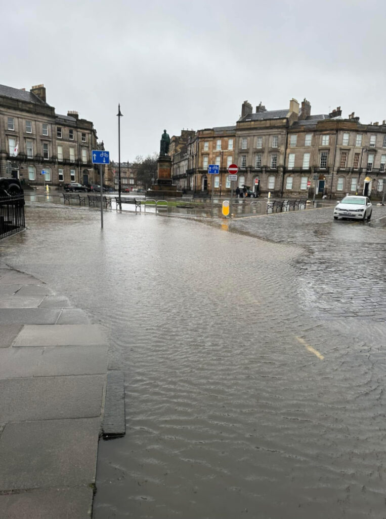 The busy street was left covered in water and nearly impassable. (C) Reddit.