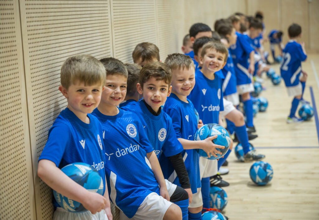 A photo of Musselburgh Windsor's children's football team sporting the new kits.