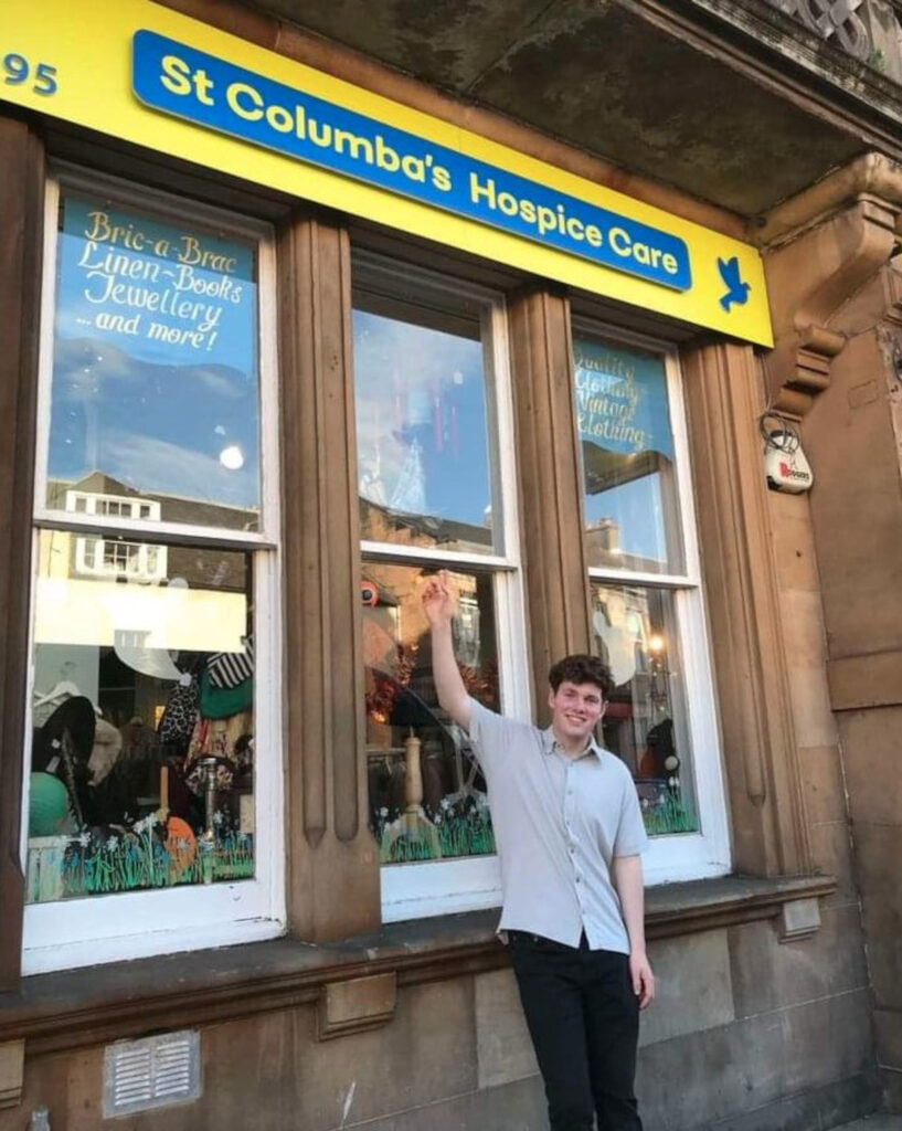 Staff member Adam outside the St Columba's Hospice store in Portobello (C) St Columba's Hospice Care/Facebook