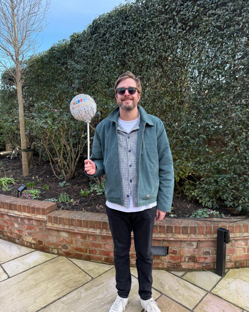 Iain Stirlgin holding a balloon in an image uploaded to  his social media pages.