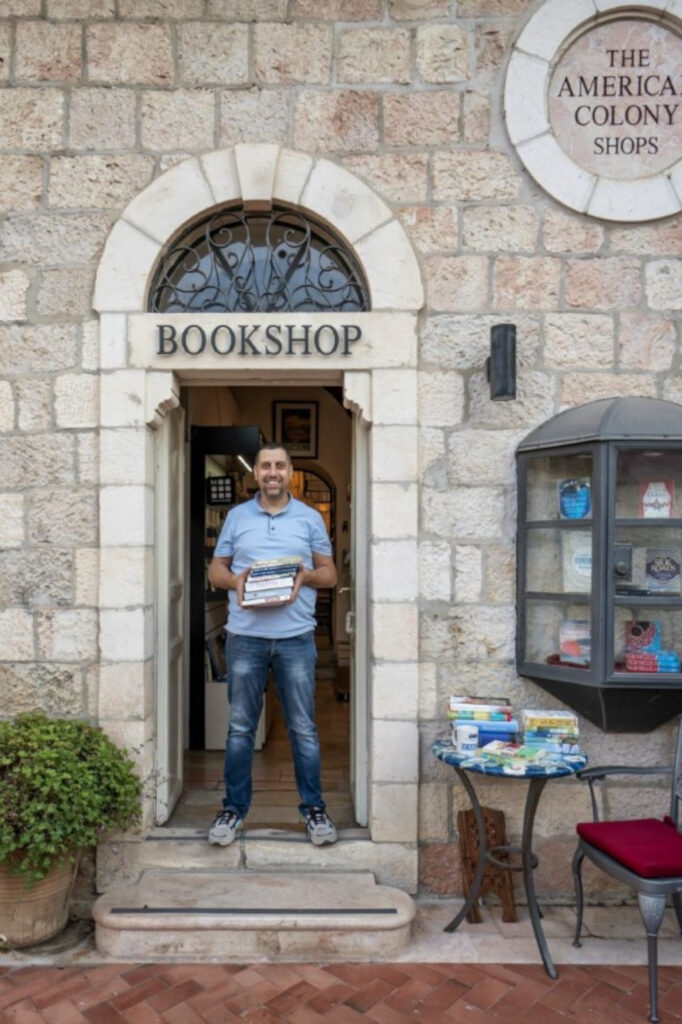 Mahmoud Muna outside his bookshop (C) @nirhasson/X