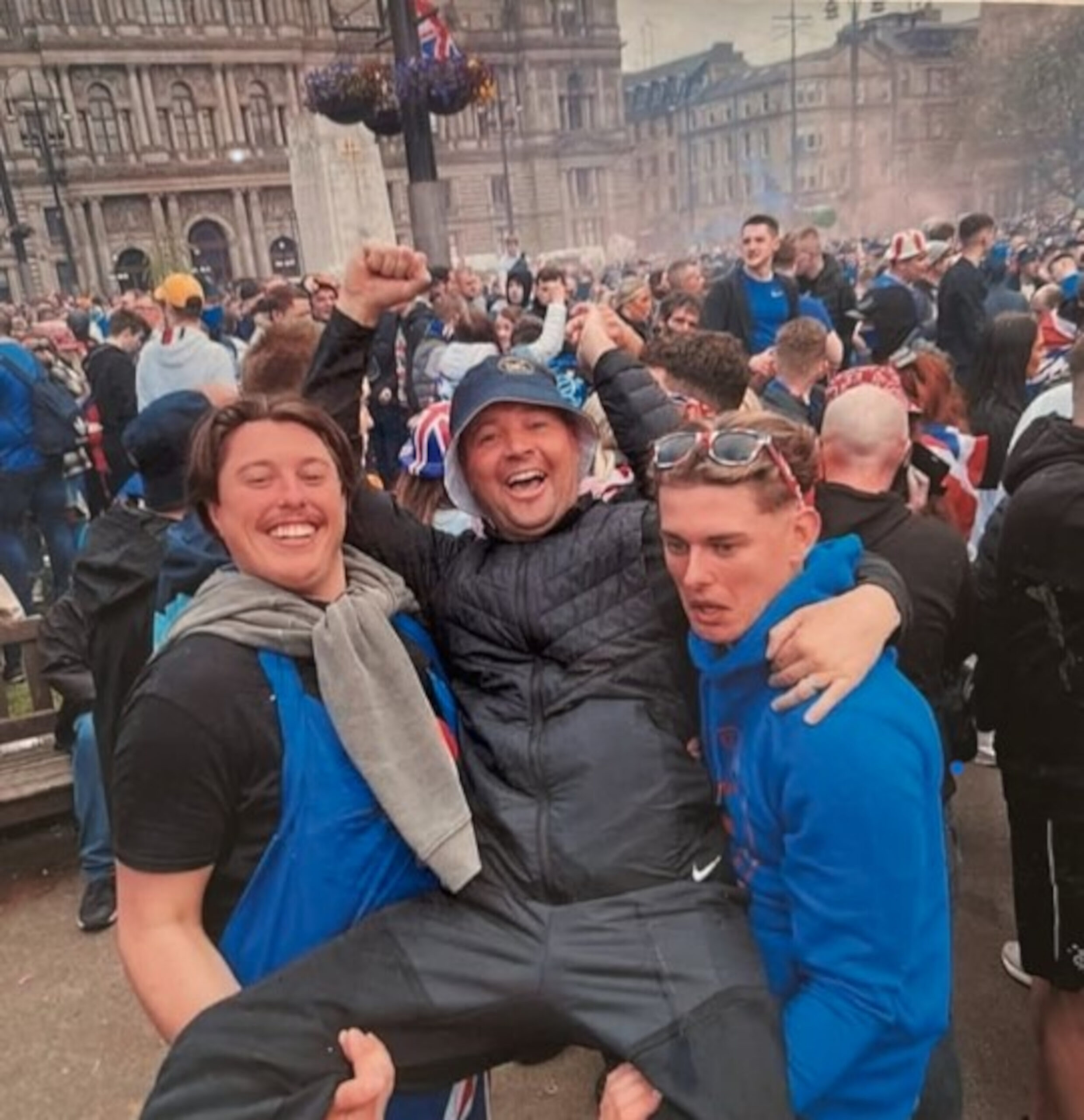 Christopher (middle) with friends and fellow Rangers fans (C) @mckernandaryl/Instagram