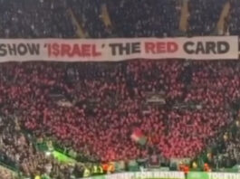 Celtic fans raising a sign that says "Show 'Israel' the red card" at their match against Bayern Munich last month (C) @green.brigade.ultras/Instagram